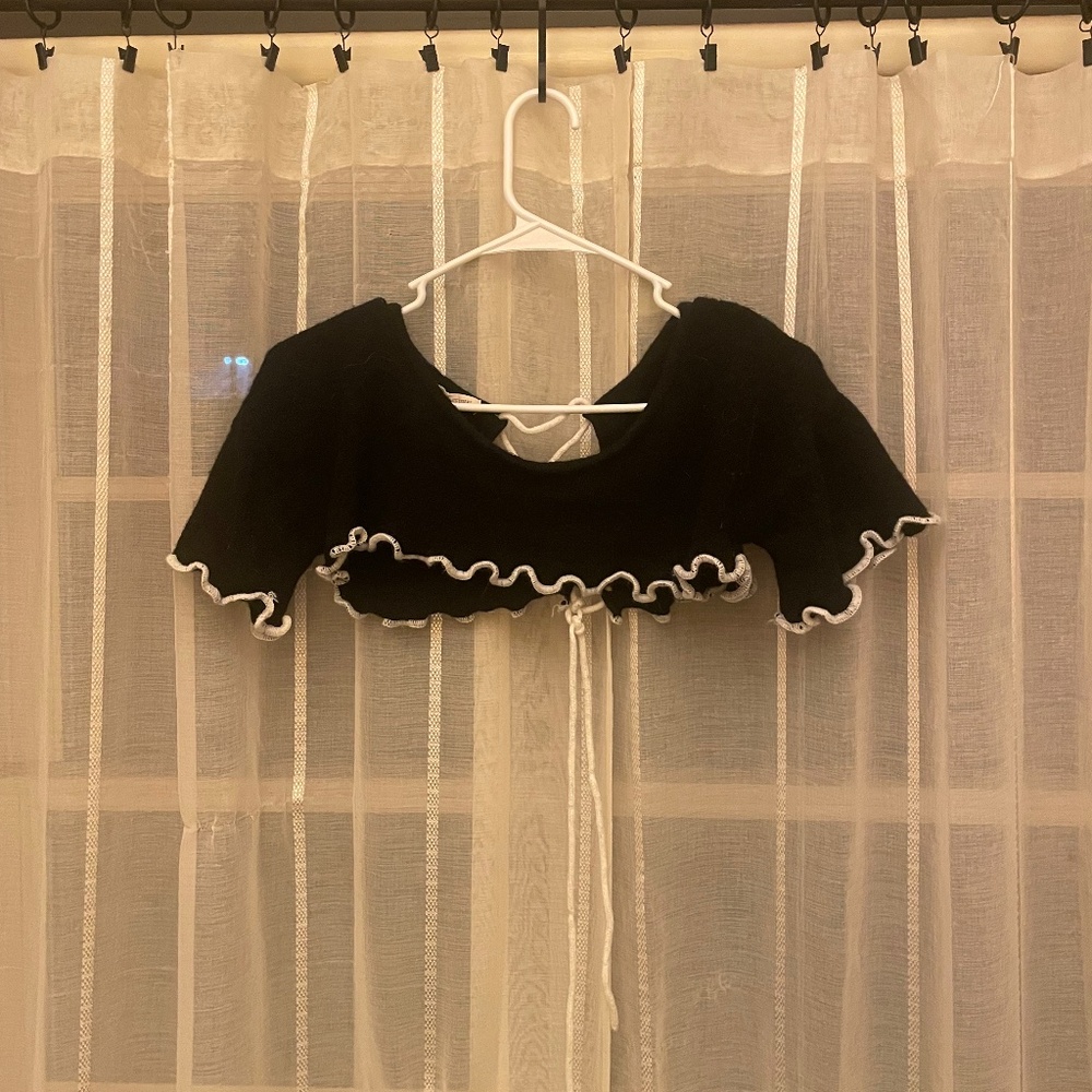 Black cropped sweater with white accents